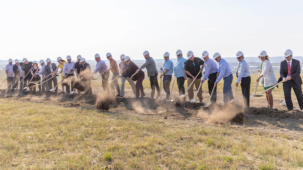 People shoveling the dirt