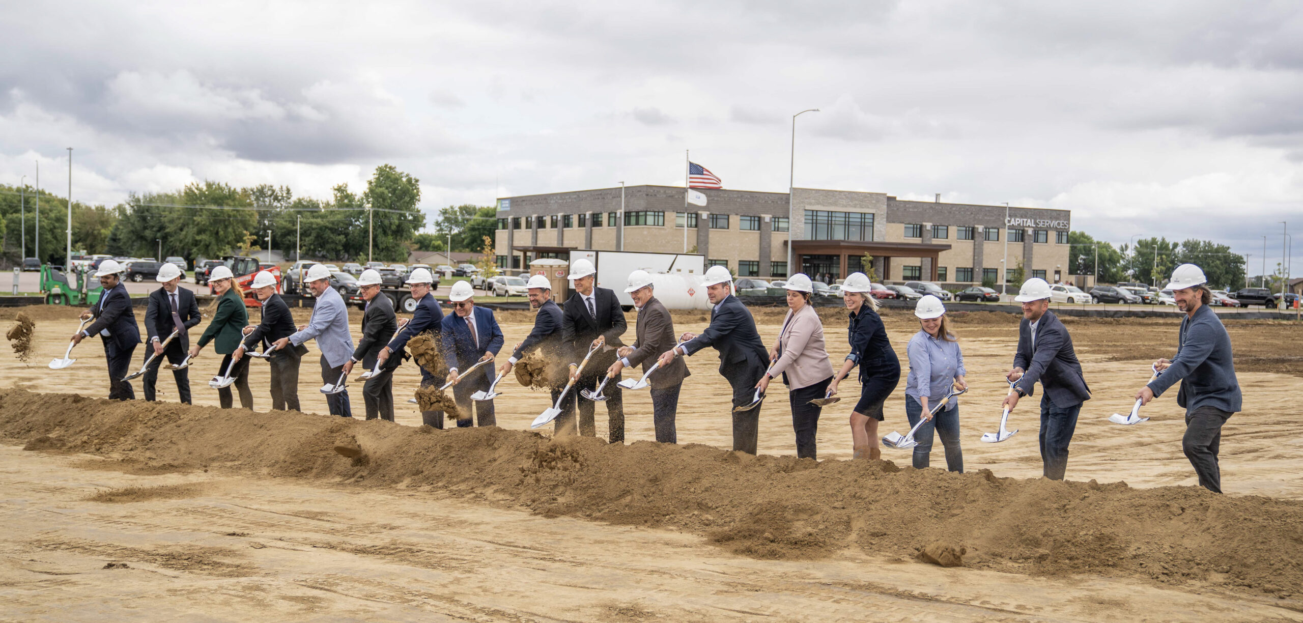 South Dakota State officials and contractors officially shovel dirt at the groundbreaking ceremony in Sioux Falls