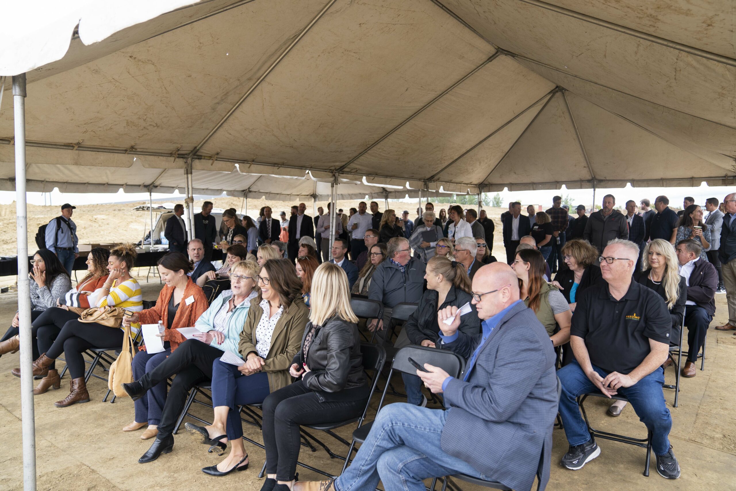 hundreds of people wait for a groundbreaking ceremony in Sioux Falls