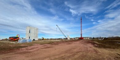 cranes and precast concrete at a construction site in Sioux Falls